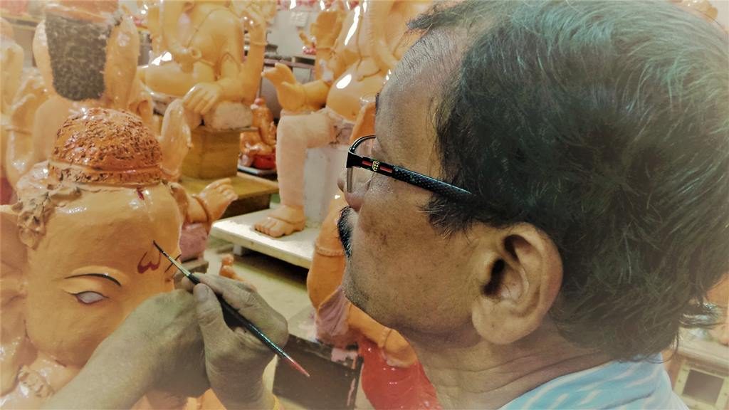 Painting in progress. Ganapathi idols in clay